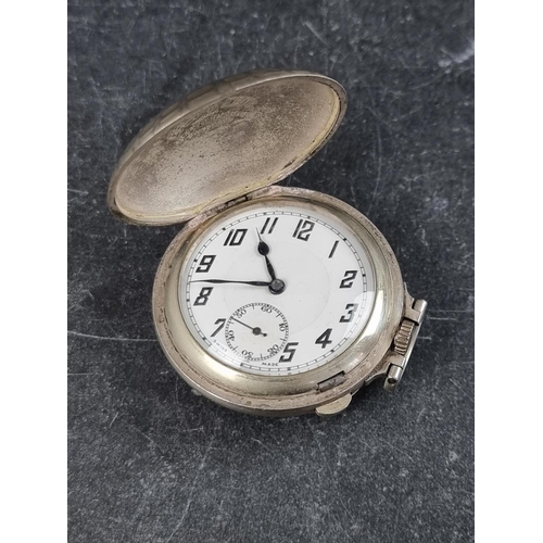 594 - A vintage Swiss nickel plated stem wind hunter cased pocket watch, of stylised golf ball form, 37mm.... 