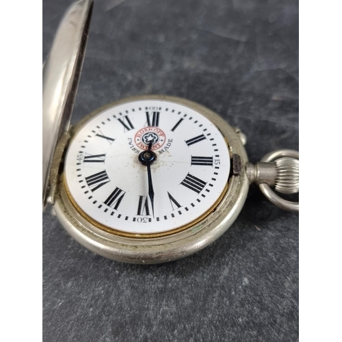 595 - A Swiss silver plated stem wind hunter pocket watch, by Roskopf, 38mm; together with a .935 key wind... 