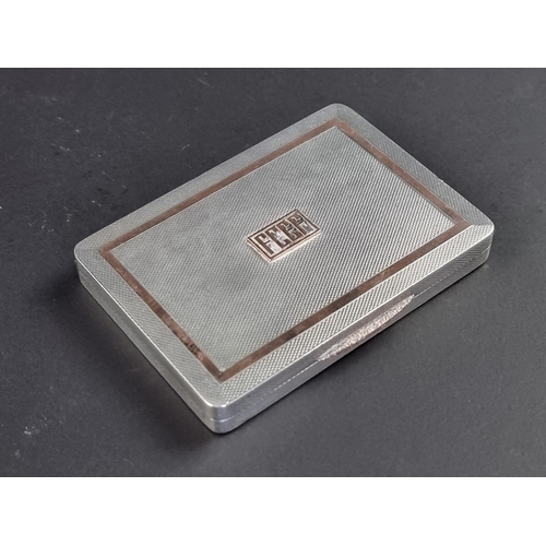 65 - An engine turned silver cigarette case, by W H Manton Ltd, Birmingham 1946, 8cm wide, 98g.... 