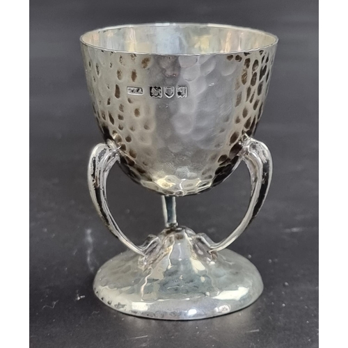 75 - An Arts & Crafts hammered silver egg cup, by Philip Hanson Abbot, London 1911, 6.5cm high, 56g.... 