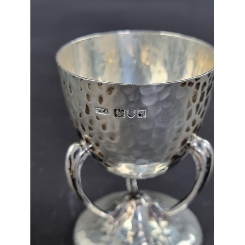 75 - An Arts & Crafts hammered silver egg cup, by Philip Hanson Abbot, London 1911, 6.5cm high, 56g.... 