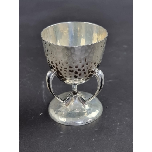 75 - An Arts & Crafts hammered silver egg cup, by Philip Hanson Abbot, London 1911, 6.5cm high, 56g.... 