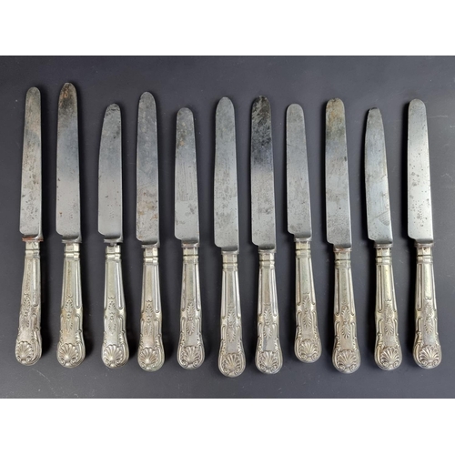 79 - Eleven silver handled Queen's pattern table knives.