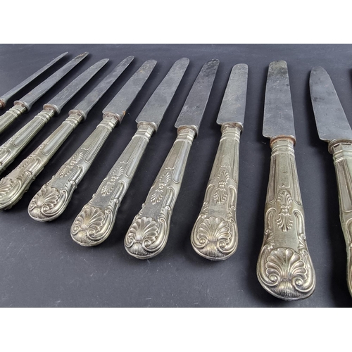 79 - Eleven silver handled Queen's pattern table knives.