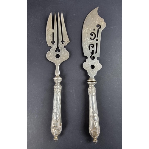 84 - A pair of German white metal handled fish servers, stamped '800'.