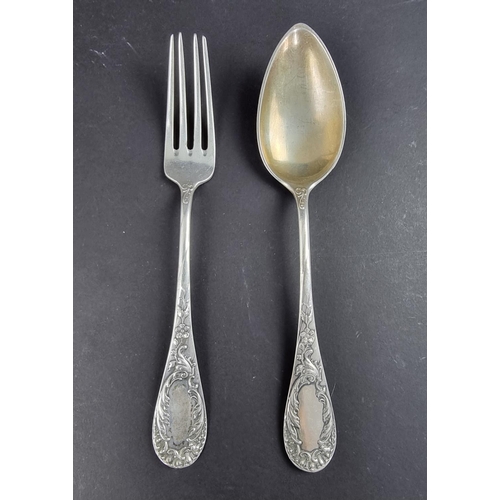 94 - A German white metal fork and matching spoon, stamped '800'. (2)