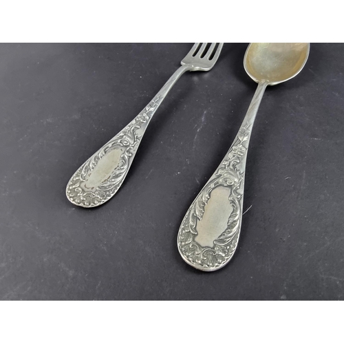 94 - A German white metal fork and matching spoon, stamped '800'. (2)