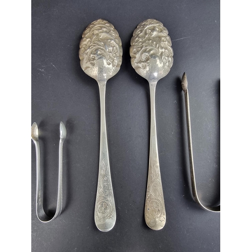 98 - A pair of late Victorian silver spoons, by I S, London 1901; together with two pairs of silver sugar... 