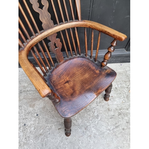 1069 - A Victorian ash, beech and elm Windsor armchair.