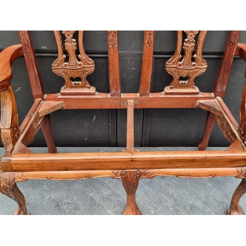 1074 - A child's 18th century style carved mahogany chair back settee, 73.5cm wide.