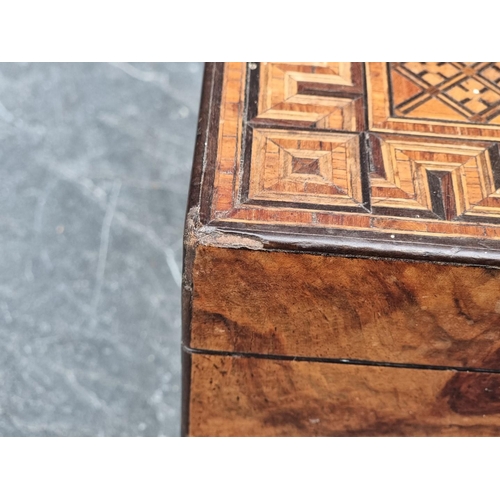 1090 - A Victorian parquetry tea caddy, 24.5cm wide.