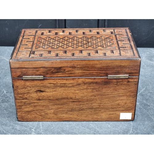 1090 - A Victorian parquetry tea caddy, 24.5cm wide.