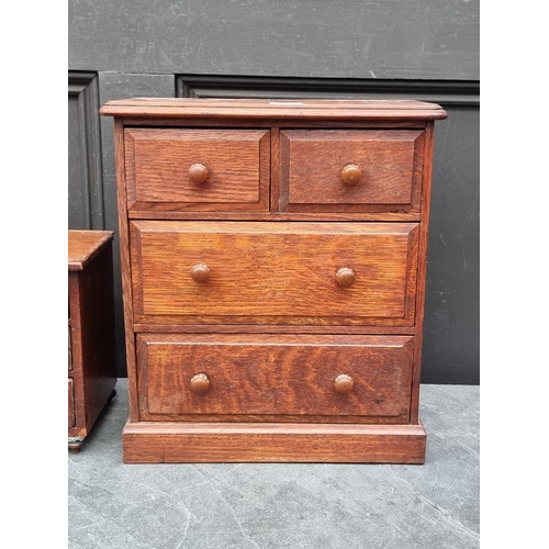 1098 - A miniature Victorian walnut three drawer chest, with bone escutcheons, 21.5cm high x 22cm wide... 