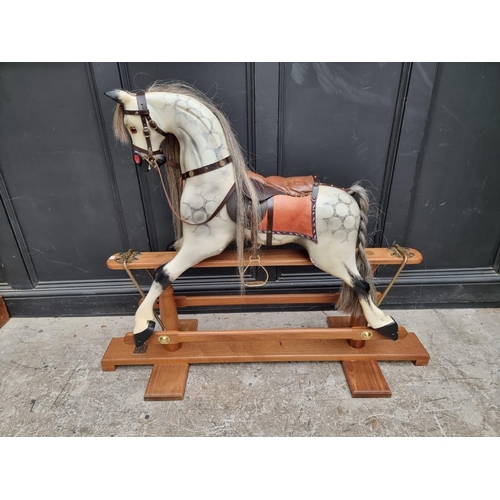 1716 - A dapple grey rocking horse, 135cm wide.  