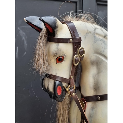 1716 - A dapple grey rocking horse, 135cm wide.  