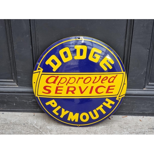 1748 - An enamel 'Dodge Plymouth approved Service' convex sign, 56cm diameter. 