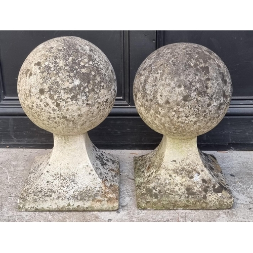 1770 - An old pair of weathered composition stone gate pier finials, largest 50cm high. ... 