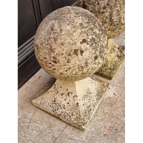 1770 - An old pair of weathered composition stone gate pier finials, largest 50cm high. ... 