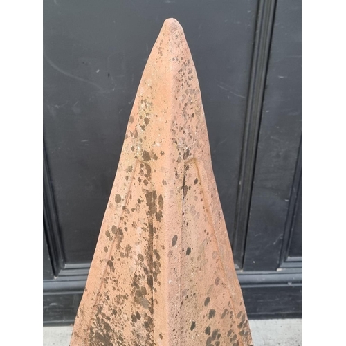 1771 - A terracotta obelisk, 96.5cm high; together with a similar fluted garden pot, 32cm high.... 