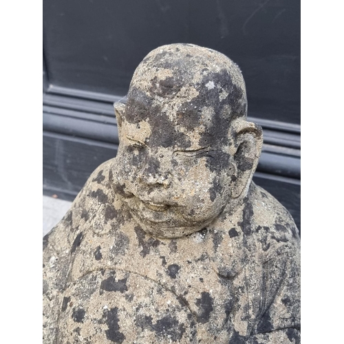 1775 - An old composition stone seated Buddha, 38cm high. 