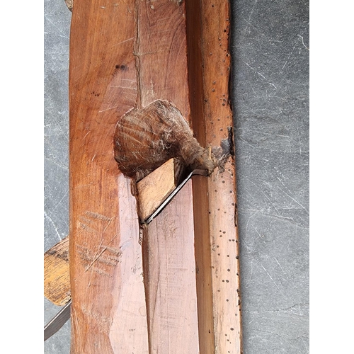 1778 - An unusual antique French walnut carpenter's plane, 67cm long. 