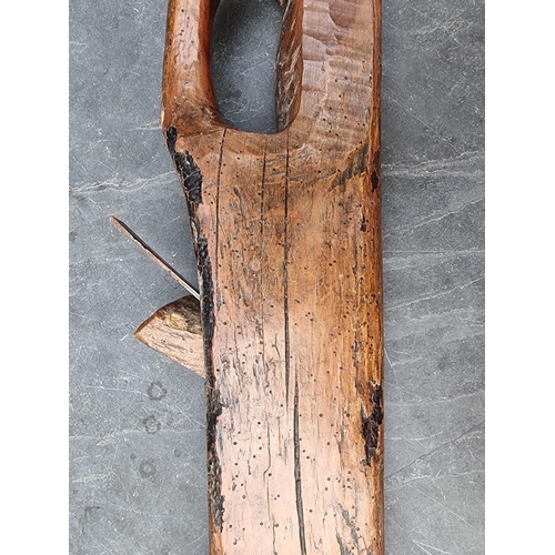 1778 - An unusual antique French walnut carpenter's plane, 67cm long. 