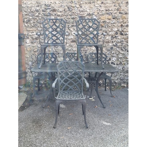 1823 - An aluminium garden table and six chairs, the table 159cm wide.