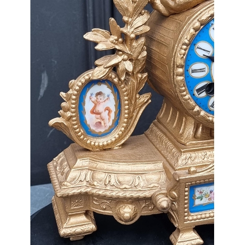 1110A - A late 19th century gilt spelter and Sevres style mantel clock, 32cm high, (with later battery ... 