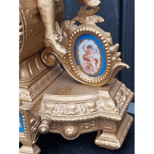 1110A - A late 19th century gilt spelter and Sevres style mantel clock, 32cm high, (with later battery ... 