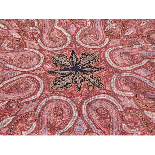 1141 - A large antique Kashmiri paisley shawl, 200 x 195cm.