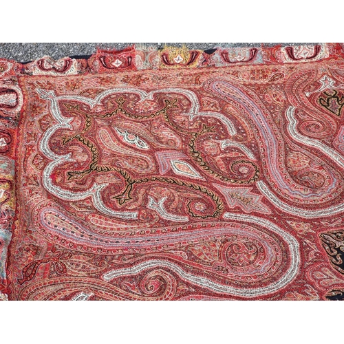 1141 - A large antique Kashmiri paisley shawl, 200 x 195cm.