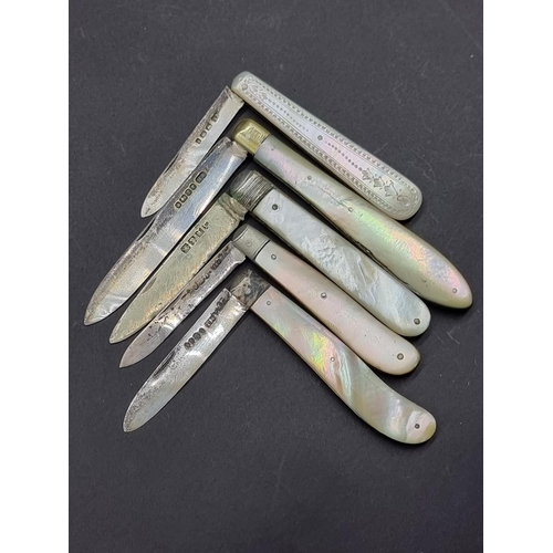 1686 - Five mother-of-pearl and silver folding fruit knives.