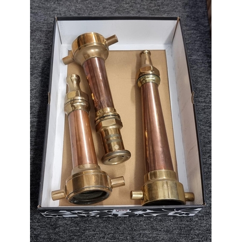 1699 - Three Victorian copper and brass fire hose nozzles, largest 41.5cm long.