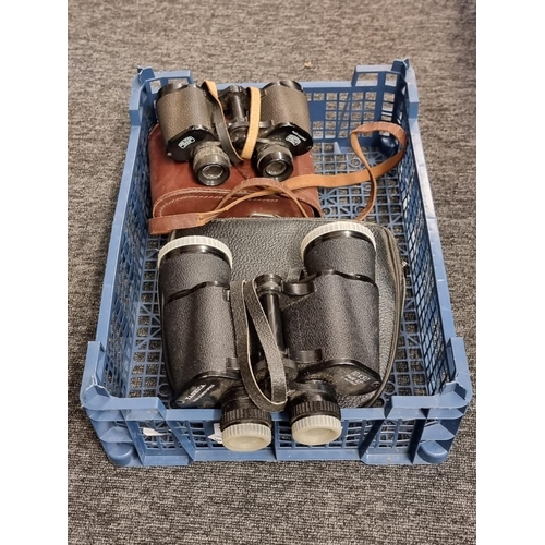 1700 - A pair of Yashica 10x50 binoculars, in case; together with another pair of Carl Zeiss Jenoptem 8x30w... 