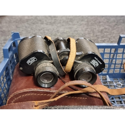 1700 - A pair of Yashica 10x50 binoculars, in case; together with another pair of Carl Zeiss Jenoptem 8x30w... 