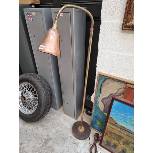 1719 - A copper and brass articulated floor lamp. 