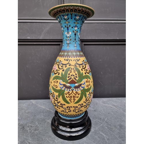 1722 - A Japanese porcelain vase, simulating cloisonne enamel, 39cm high, (restored), on opaque glass stand... 