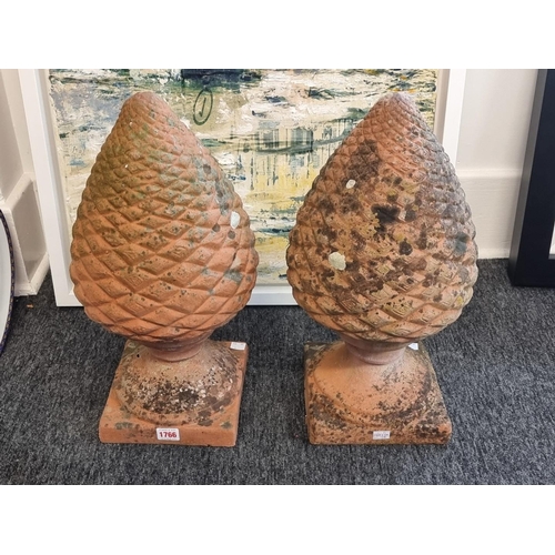 1766 - A pair of terracotta pinecone gate pier finials, 48cm high.