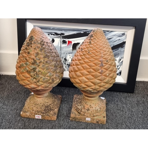 1767 - A pair of terracotta pinecone gate pier finials, 48cm high.