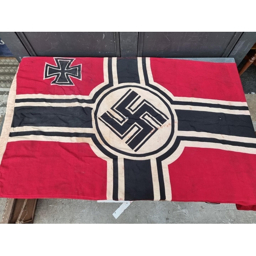 1804 - A WWII German Kriegsmarine flag, indistinctly stamped to band, 145 x 76cm.