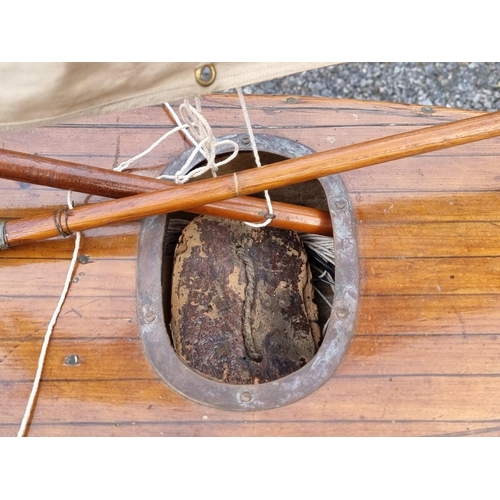 1830 - An old pond yacht, the hull 66cm long, on mahogany stand. 