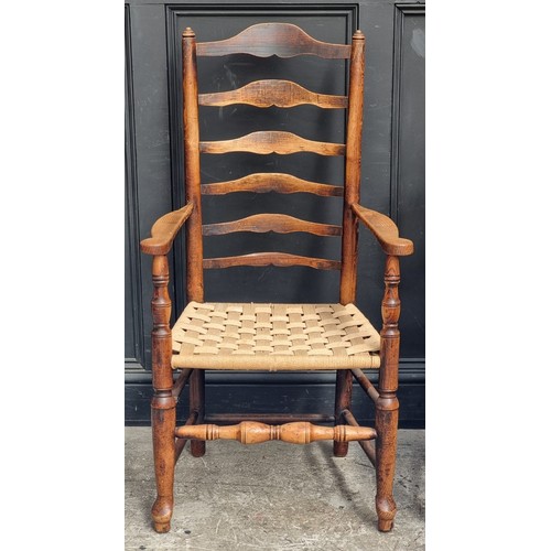 1065 - An antique beech lath back kitchen elbow chair; together with another ash, elm and beech wheelback W... 