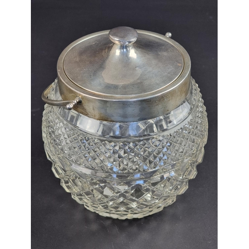 36A - A silver mounted cut glass biscuit barrel and cover, by J E Ltd, London 1925, 19cm high.... 