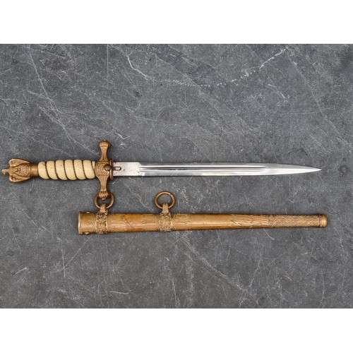 1796 - A WWII German Kriegsmarine officer's dagger and sheath, no makers mark, with 25cm blade.... 