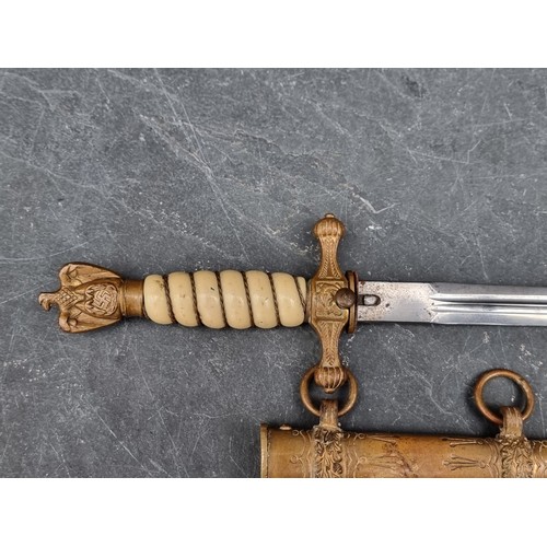 1796 - A WWII German Kriegsmarine officer's dagger and sheath, no makers mark, with 25cm blade.... 