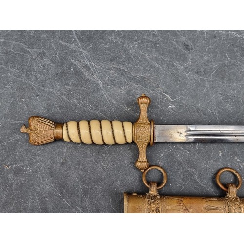 1796 - A WWII German Kriegsmarine officer's dagger and sheath, no makers mark, with 25cm blade.... 