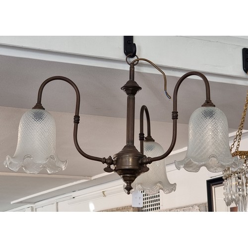 1713 - A Benson style brass three branch ceiling light, with Vaseline glass shades, 38cm high.... 