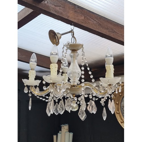 1714B - A modern five branch chandelier, having glass drops, approximately 50cm diameter.