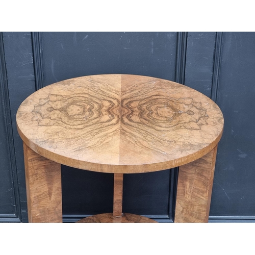 1006 - An Art Deco figured walnut circular two-tier occasional table, 82cm high x 56cm diameter.... 