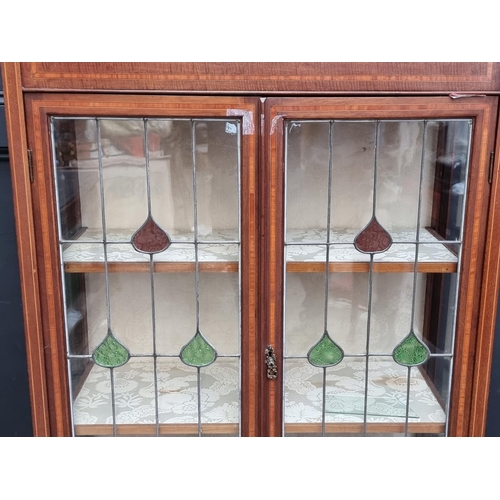 1011 - A circa 1900 mahogany and satinwood crossbanded display cabinet, with stained and leaded glass ... 